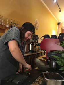 Katie Pilarsh prepares to pull a shot of espresso at Common Grounds Coffeehouse & Café on Main Street in Bluffton. Photo by Kiera Suffel