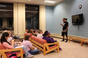 Demetrius Terry inspires the audience with poems about his life at a poetry slam in October.