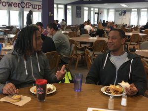 Demetrius Terry, left, and Yonas Desta eat in the Marbeck Commons. Photo by Hannah Brown