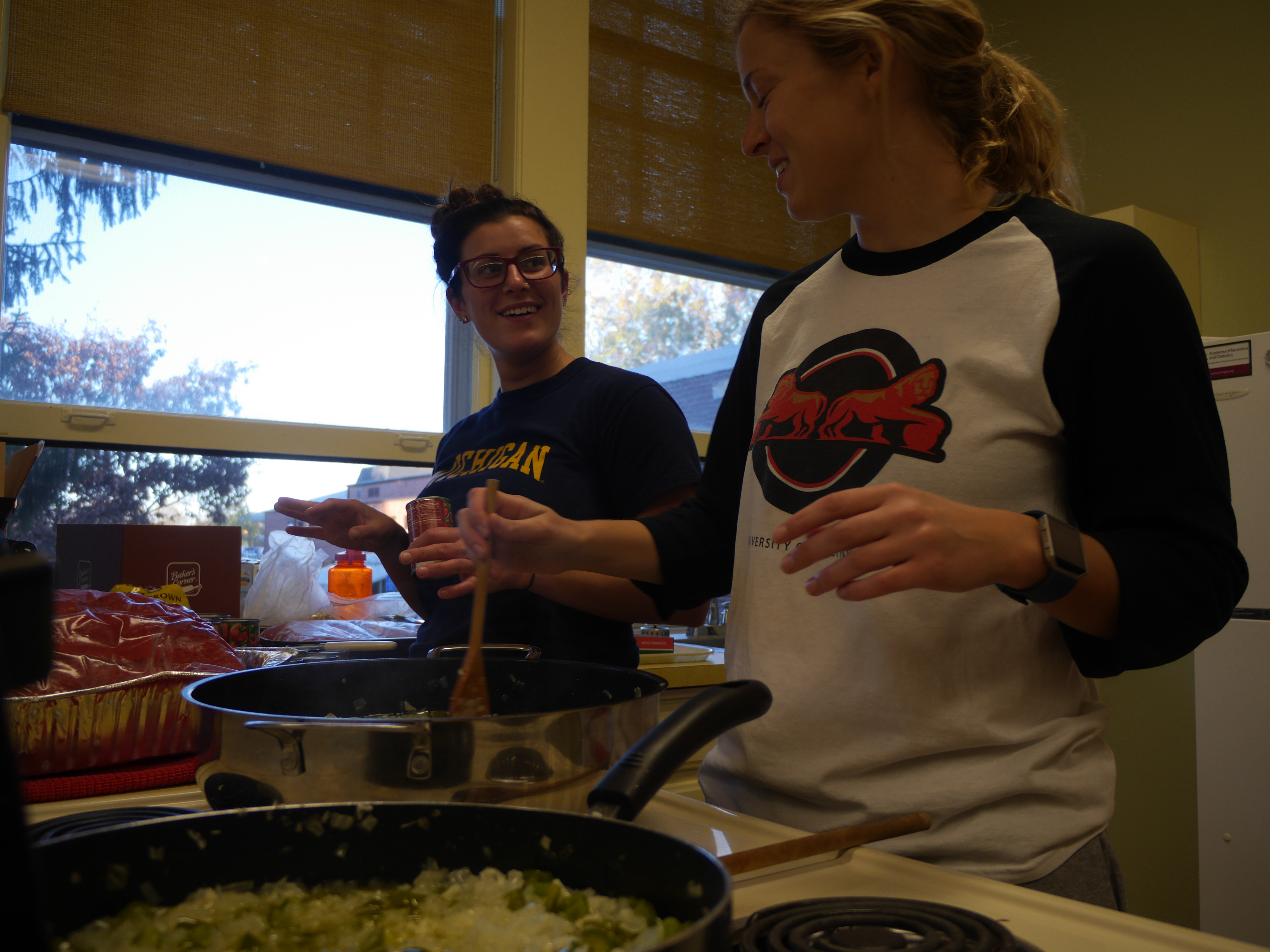 Emmy Runyan and Sierra Ditto begin preparation for the creamy tomato soup.
